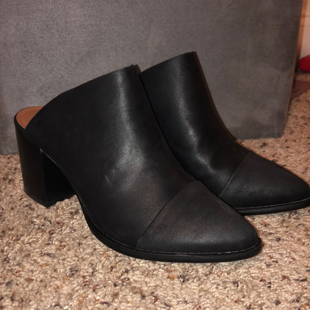 Black edgy mules with a 2.5 inch heal.